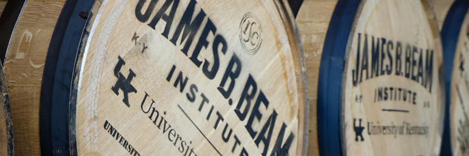 image of barrels with 'James B. Beam Insitute' printed on the lids, as well as the UK logo