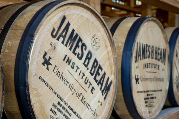 image of barrels with 'James B. Beam Insitute' printed on the lids, as well as the UK logo