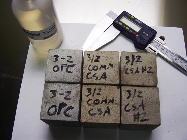 a set of calipers and test cubes of cement